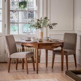 Solanis Extendable Mindi Wood Round Dining Table - Maison Rêves UK