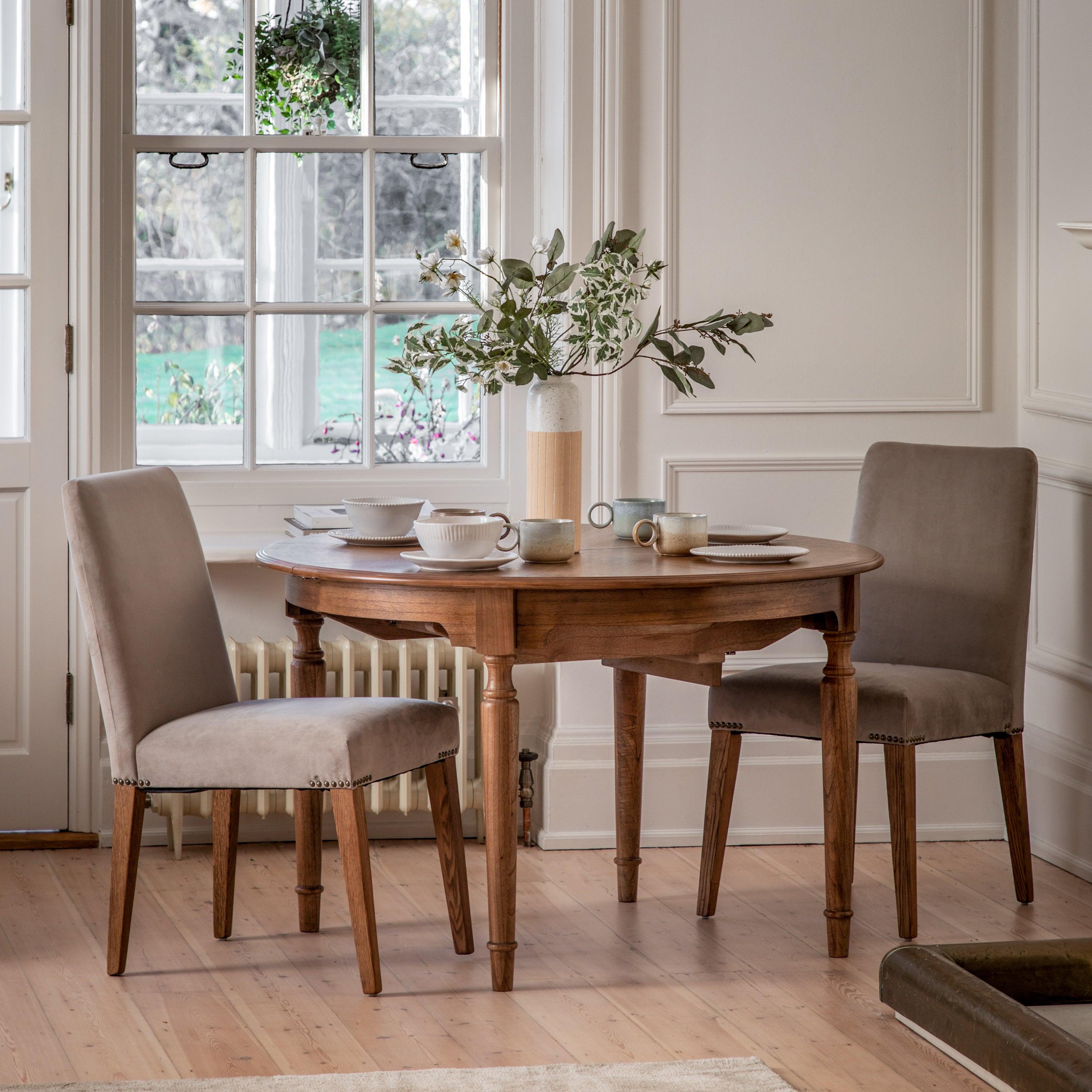 Solanis Extendable Mindi Wood Round Dining Table - Maison Rêves UK