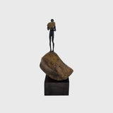 Bronze Figure On Rock High