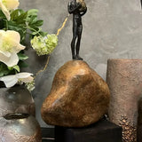Bronze Figure On Rock High